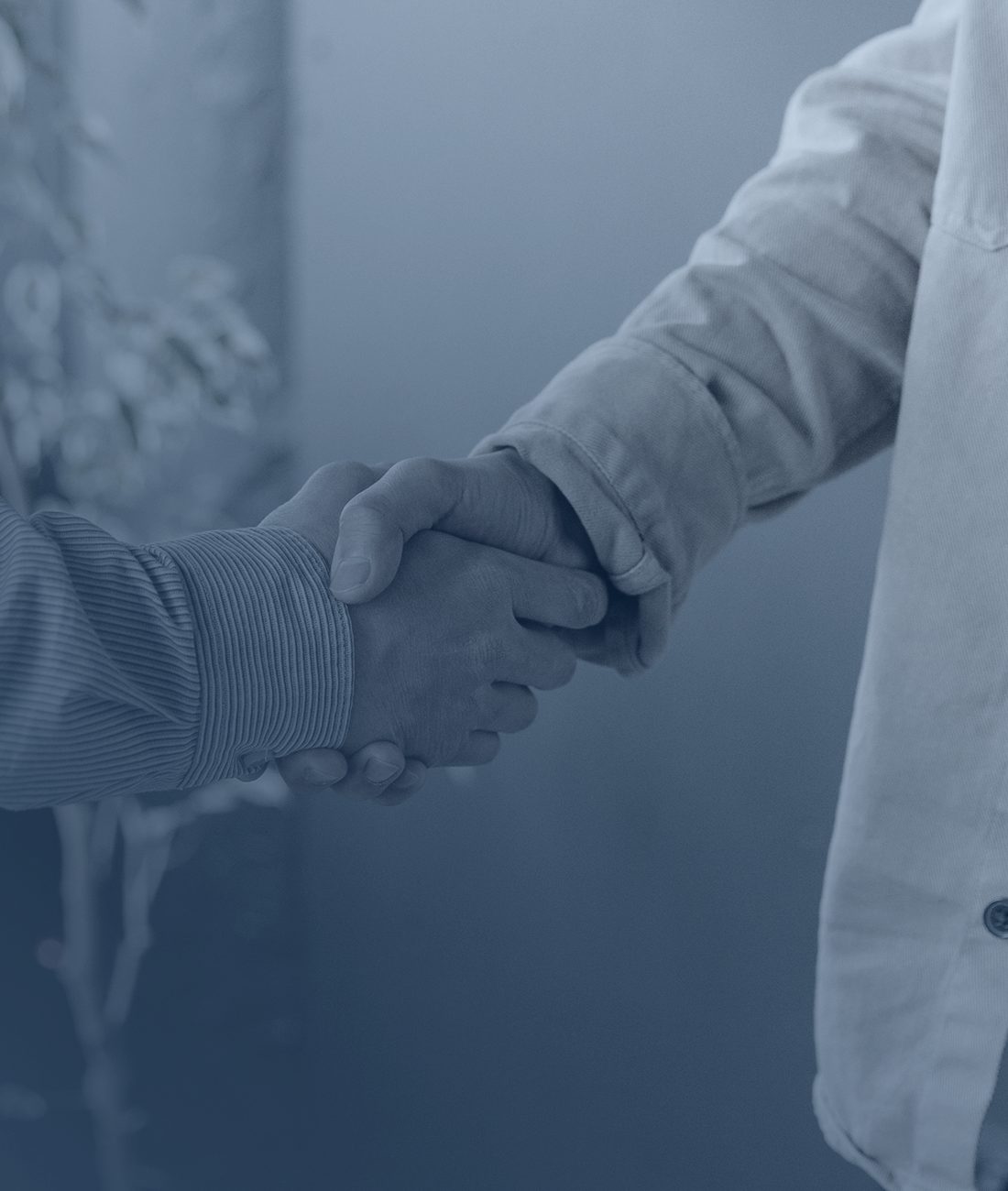 A lawyer shaking hands with a client at The Edwards Law Firm